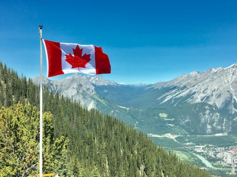 flag of Canada in the mountains