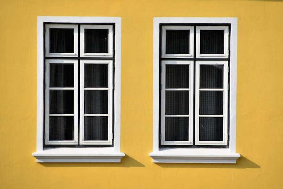 White windows on yellow walls